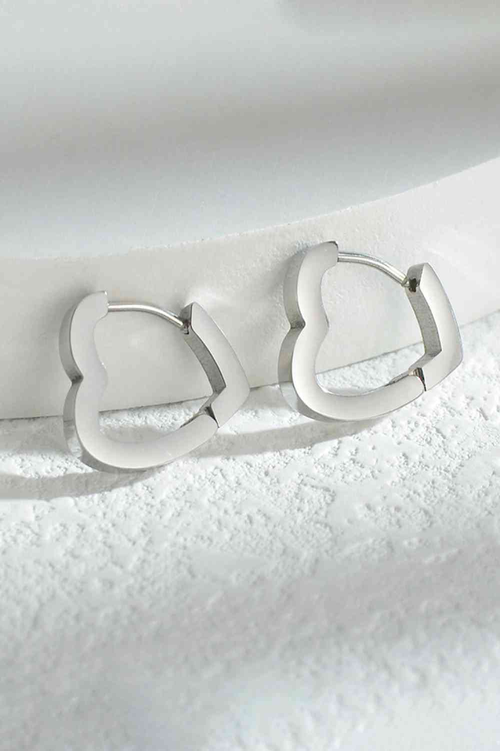 Heart shape huggies earrings in Silver. Stainless steel. Earrings can be use on a girl or women. 