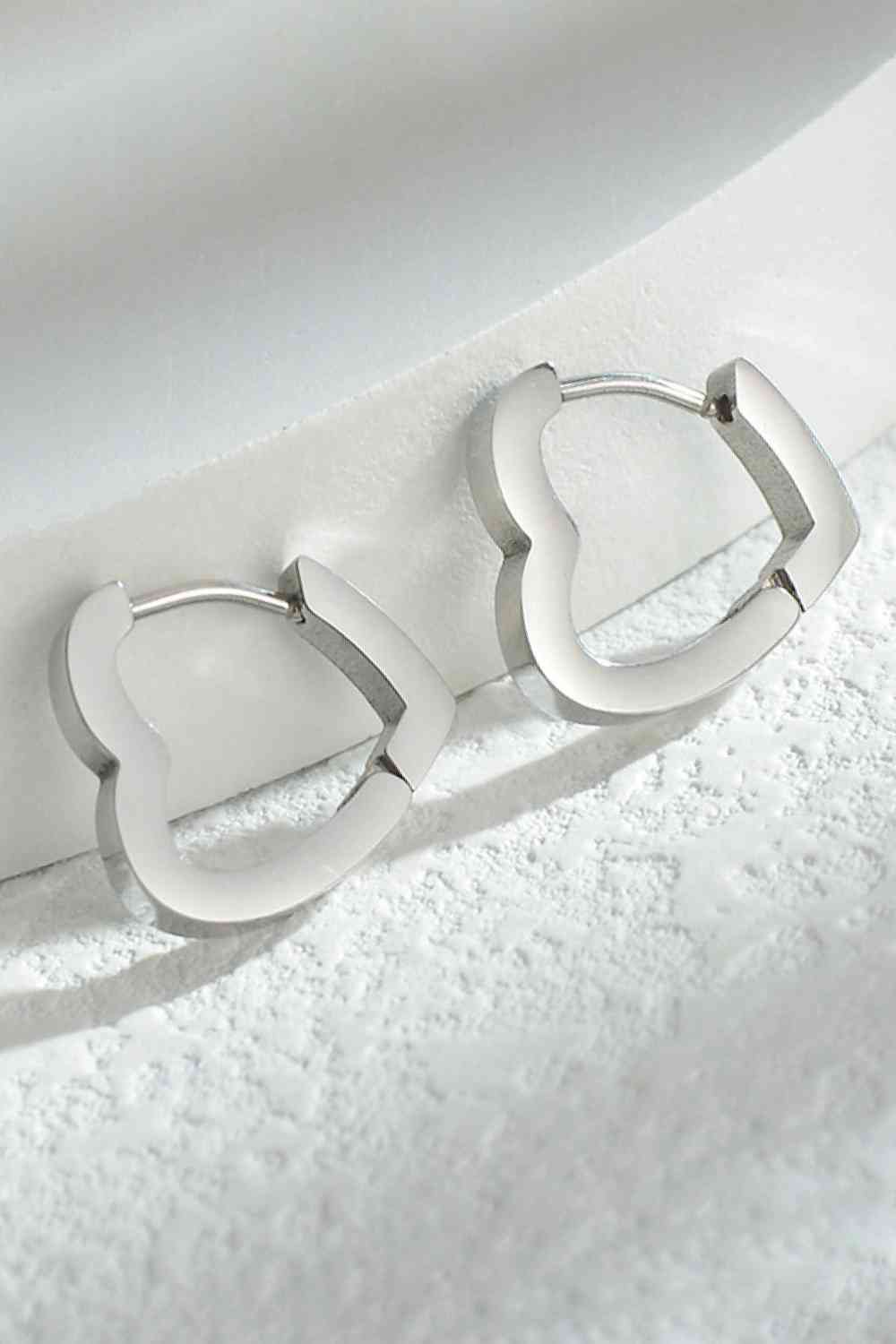 Heart shape huggies earrings in Silver. Stainless steel 